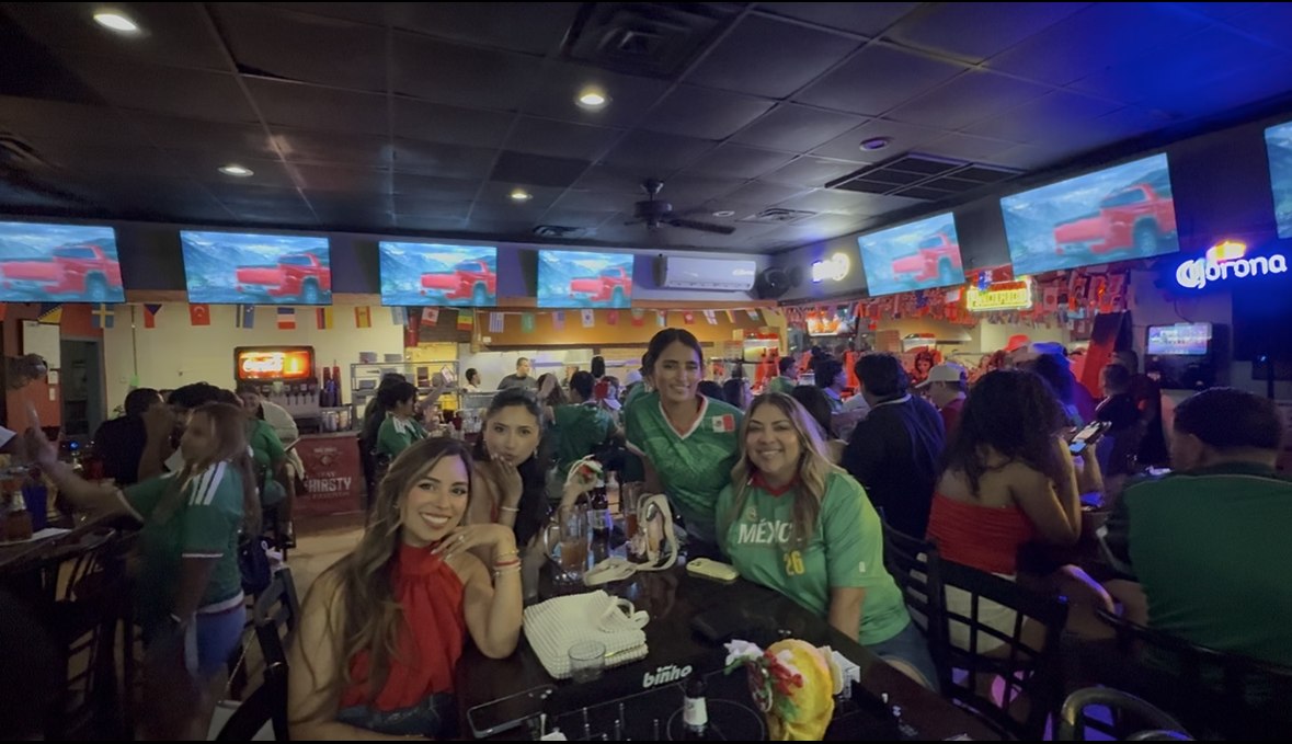 Friends in Mexico jerseys at a Good Times watch party